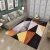 Black And Orange Geometric Figures Carpet